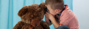 Child-examines-bear-for-ear-infection